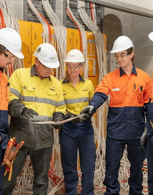 electrical-workers-talking-over-plans.jpg