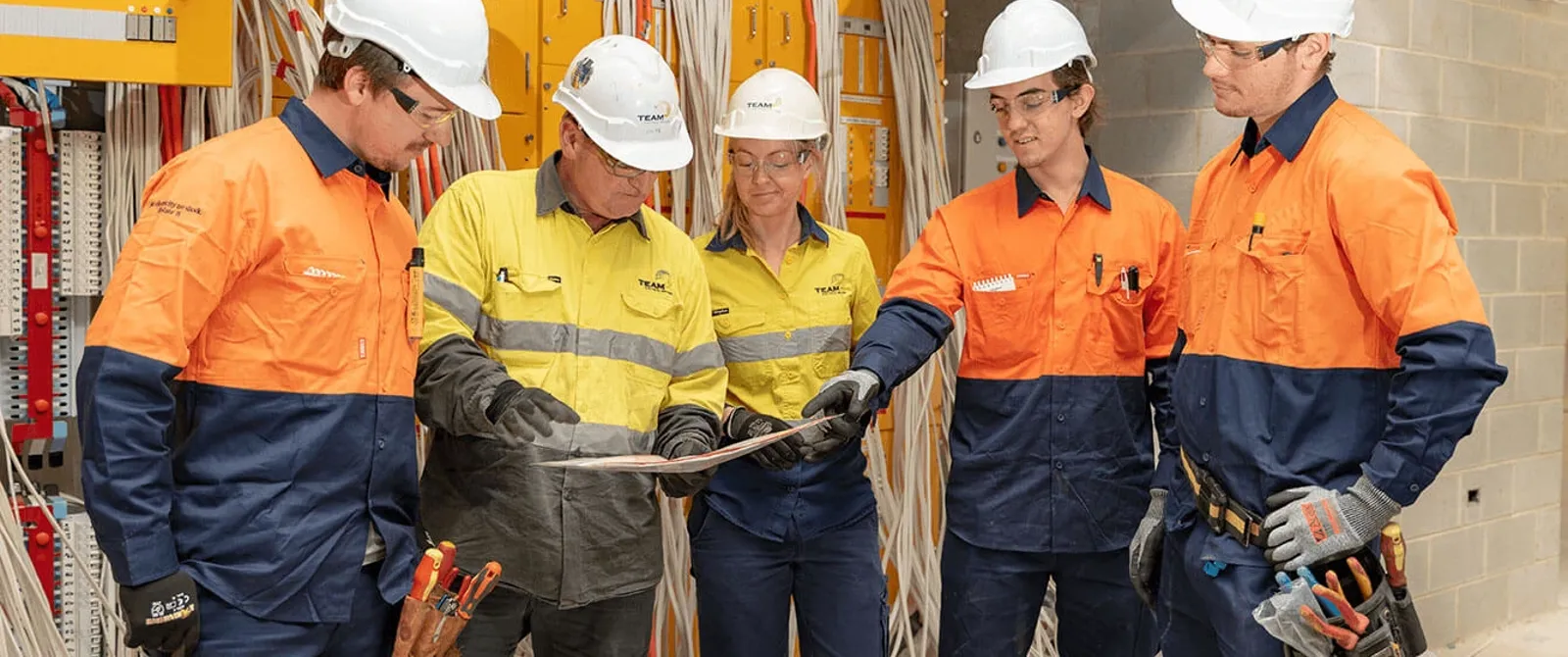 electrical-workers-talking-over-plans.jpg