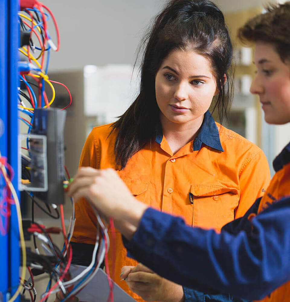 2 Electrical Apprentices Working
